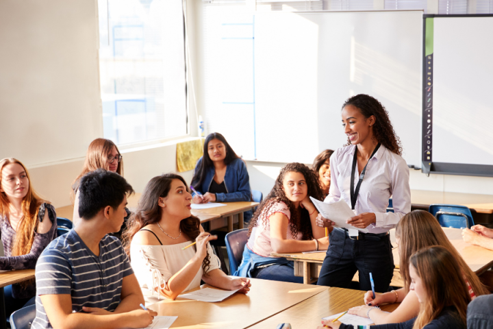 classroom of high school studies learning a lesson from a high school female teacher