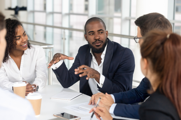 Project managers discussing project next steps at an office meeting