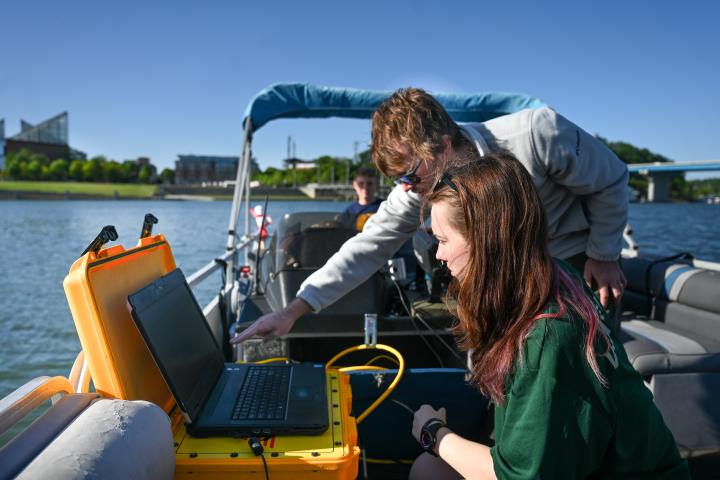 UTC Underwater archaeology students UTC Underwater archaeology students using equipment on a boat