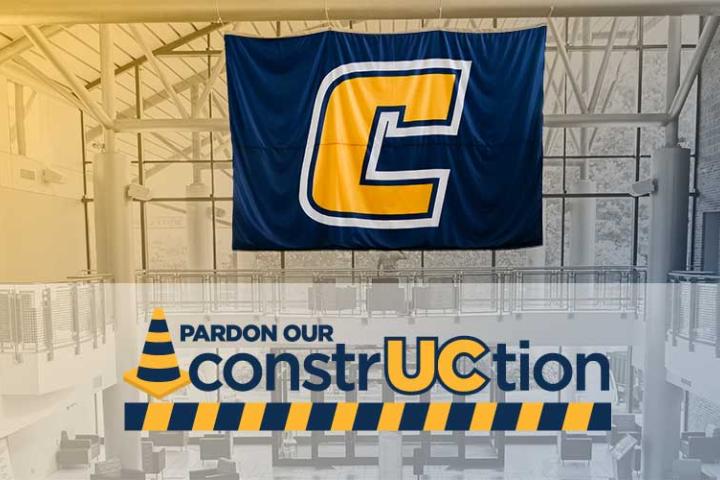 Duotone of the interior University Center with Power C flag and wordmark under construction.