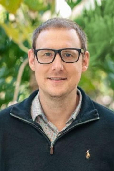 Nathaniel Hartmann Profile image of Nathaniel Hartmann wearing glasses and blue sweater with grey collar.