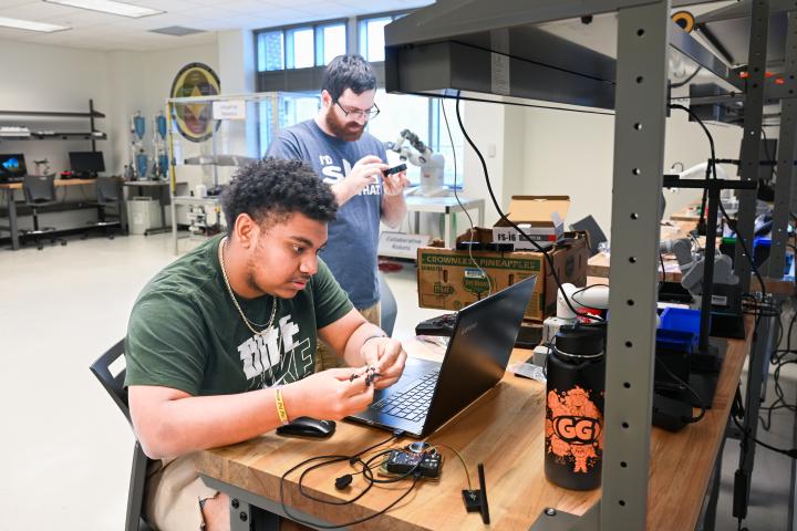 UTC mechatronics students UTC male students working in the mechatronics lab