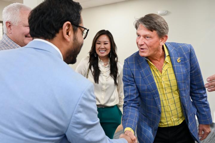 Rick Mukherjee shakes hands with UT System President, Randy Boyd Rick Mukherjee shakes hands with UT System President, Randy Boyd.