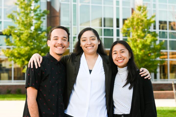 UTC first generation students Three UTC students standing together in front of the library