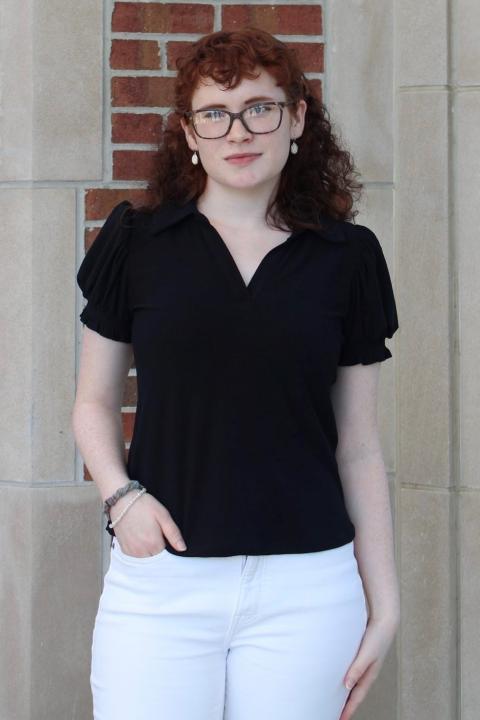 Isabella Craig Photo of student advisory member Isabella Craig in front of a brick wall