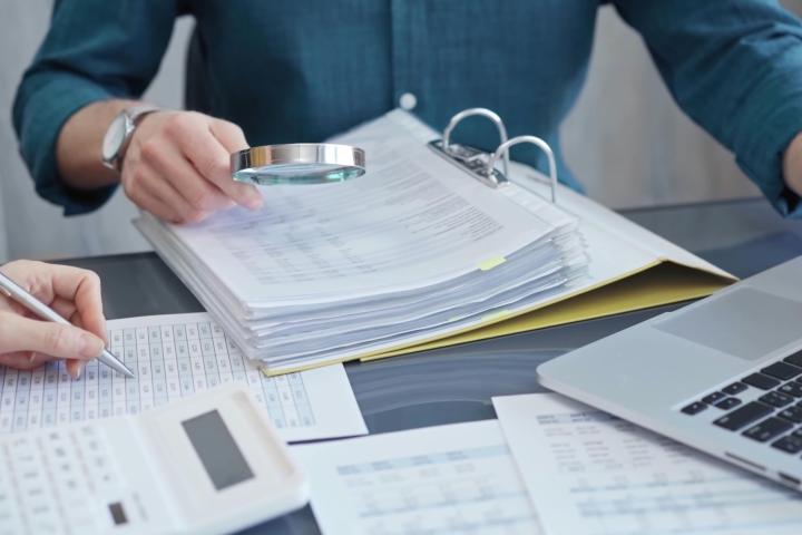 Person working on forensic accounting Person working on forensic accounting