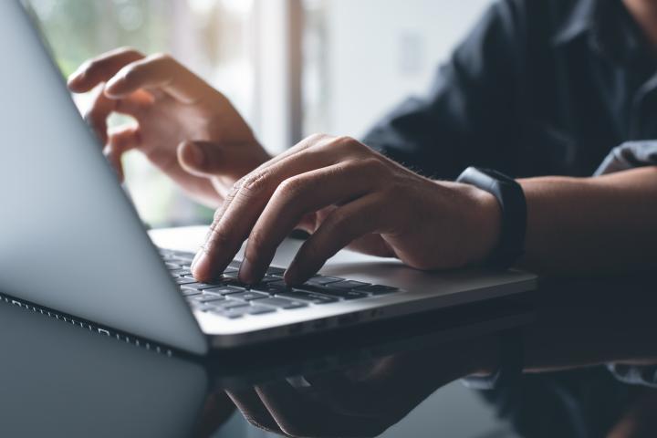 Person typing on a computer