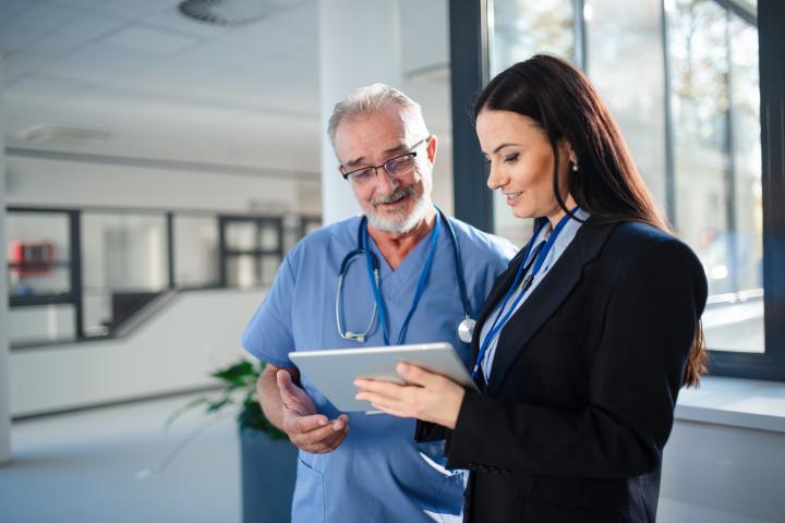 MBA healthcare Healthcare professionals looking at tablet