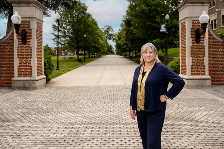 UTC Chancellor Dr. Bruce standing on campus 