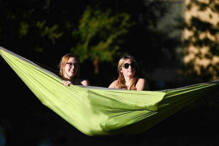 Homecoming Pep Rally two UTC students in a hammock