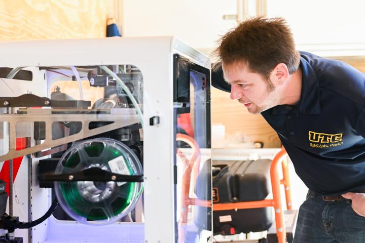 Dr. Trevor Elliott printing a project on a 3D printer