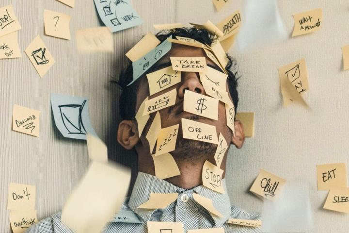 A person covered in reminder notes