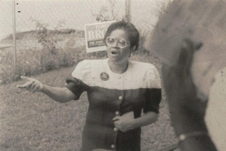 Photograph of Tommie F. Brown going door to door for her campaign, circa 1992