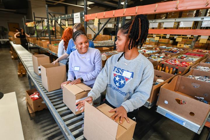 Day of Service Students work to package food at Chattanooga Food Bank