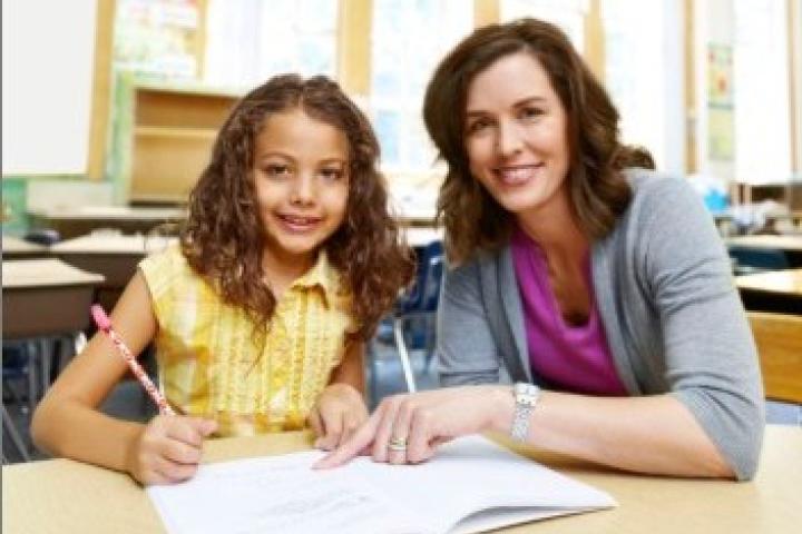 Teacher tutoring a student