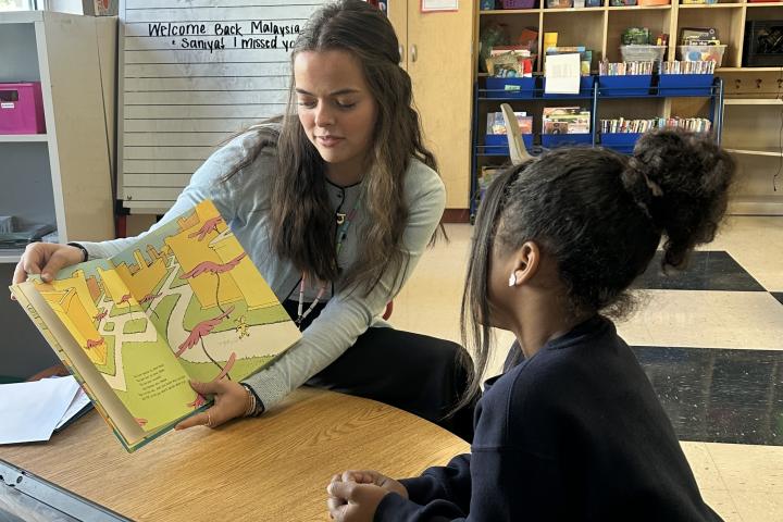 Literacy First tutor reading with Brown Academy student