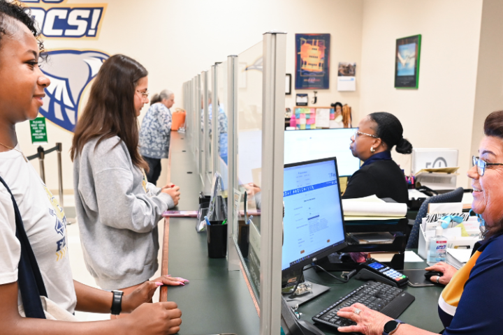 Student is assisted by a staff member in the Bursar's Office. 