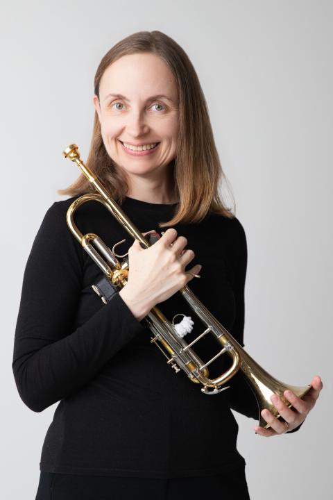 Lady holding Trumpet