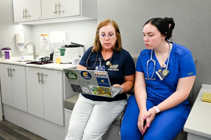 Dr. Wick teaching a student inside the mobile clinic