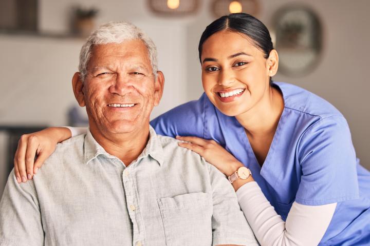 Female Certified Medical Assistant supports an elderly patient