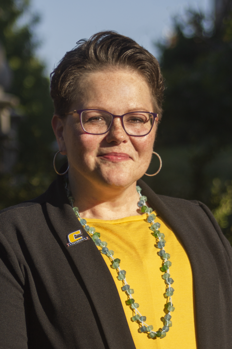 Sandra Cordell stands for a professional headshot photo. 