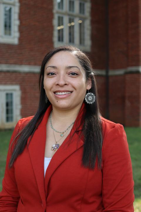 Endia Butler in front of the Gary W. Rollins College of Business