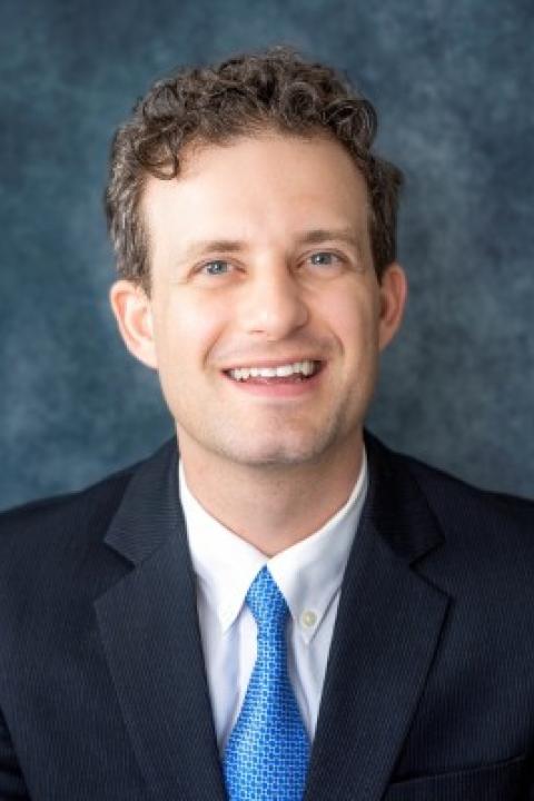 Professional headshot of Joshua Ammons