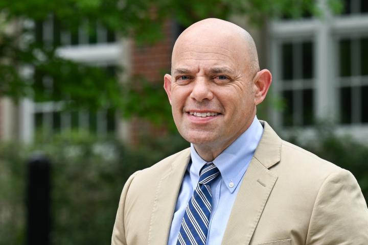 Honors College Dean Shawn Bingham standing in front of the Guerry Center. 