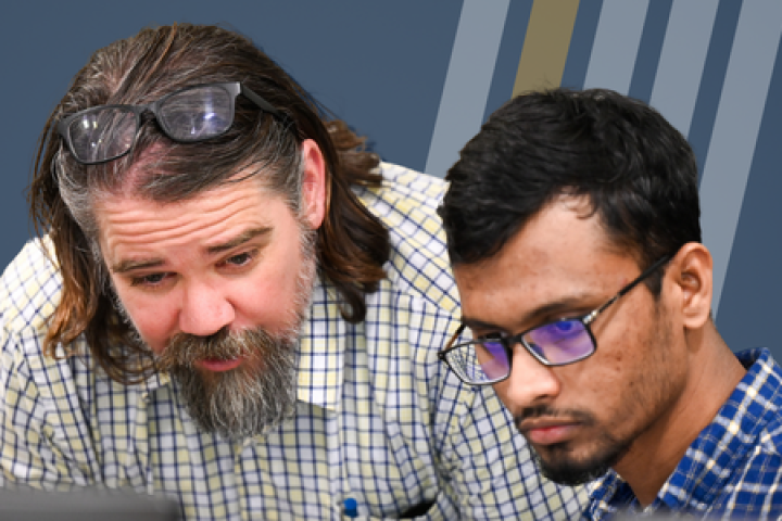UTC professor Steve Davenport works with an accounting student
