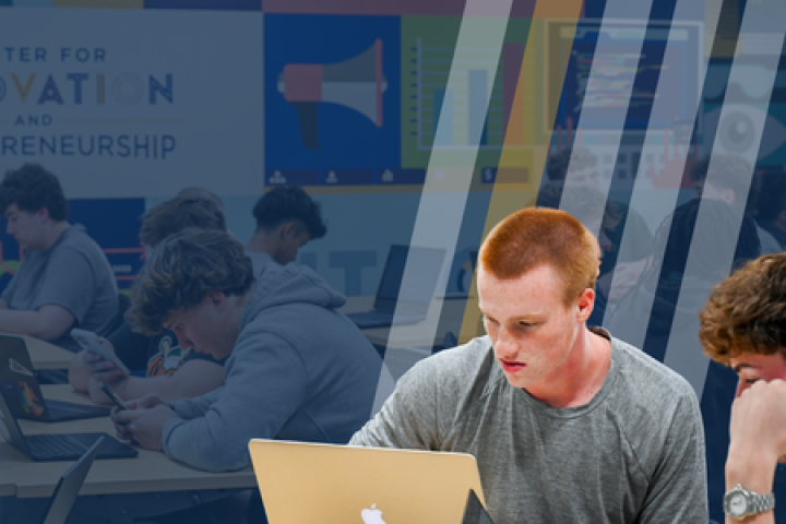 A student works on an assignment on a laptop in the Max Fuller Center for Innovation and Entrepreneurship.