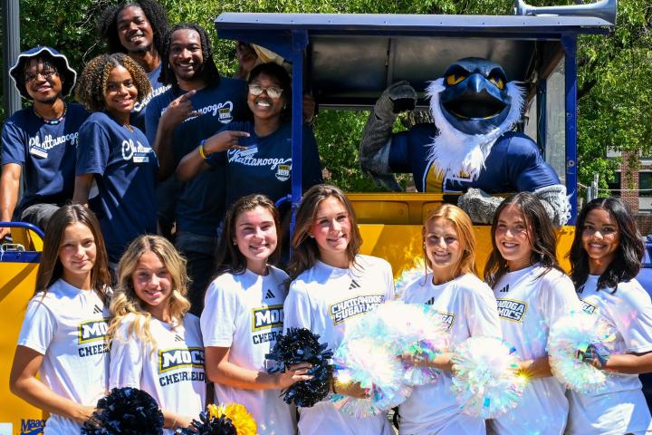 Students lined up with Scrappy on the UTC Train