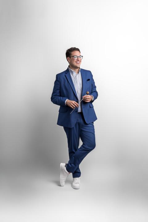 Gentleman Holding a baton in blue suit
