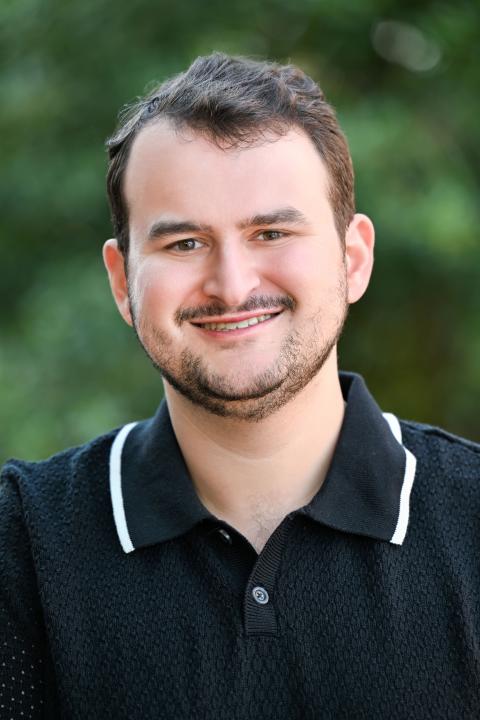 Headshot photo of visiting assistant professor, Joshua Lang
