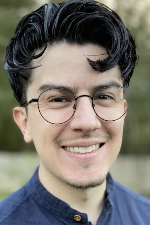 Man with glasses looking at camera