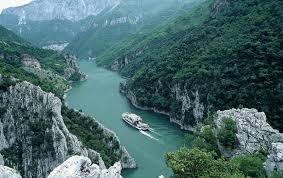 Boat on river between mountains