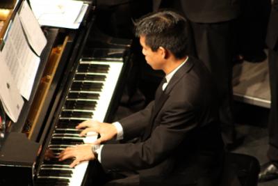 Man in tuxedo playing piano