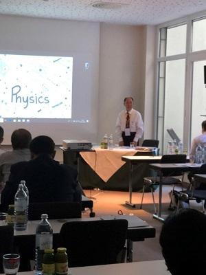 International Conference Man gives presentation on Physics in front of audience