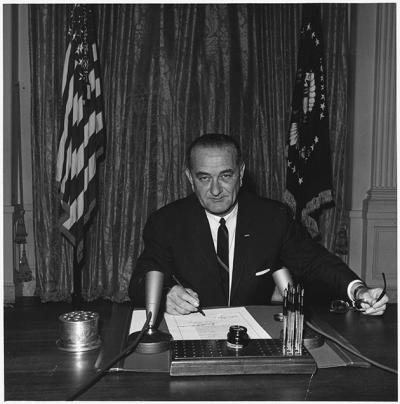 President Lyndon B. Johnson signs the Gulf of Tonkin resolution
