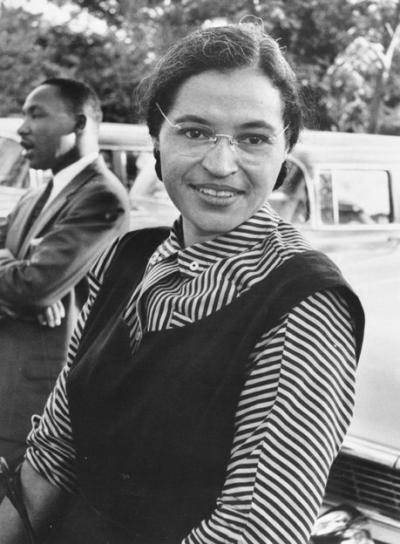 Rosa Parks with Martin Luther King Jr. in the background