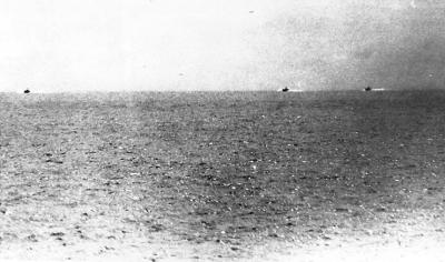 a photo taken from the USS Maddox during the incident, showing three North Vietnamese motor torpedo boats.