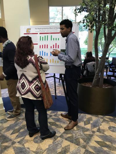 Jaylen Mans presenting his summer research