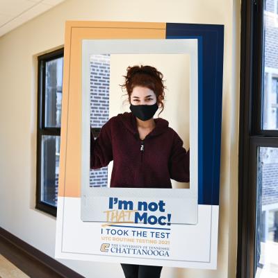 Kaylah isn't THAT Moc UTC student Kaylah poses behind frame that reads: I'm not THAT Moc! I took the test.