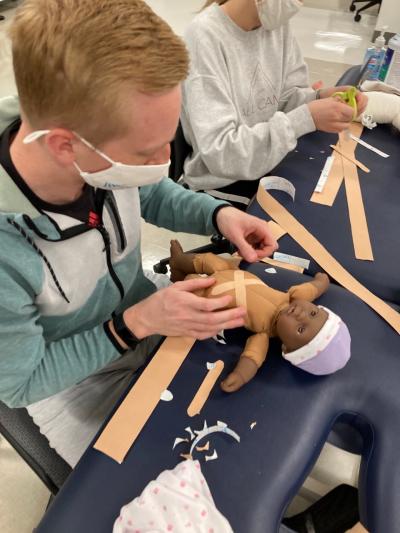 UTC DPT pediatrics class lab- 2 UTC DPT students in pediatrics lab