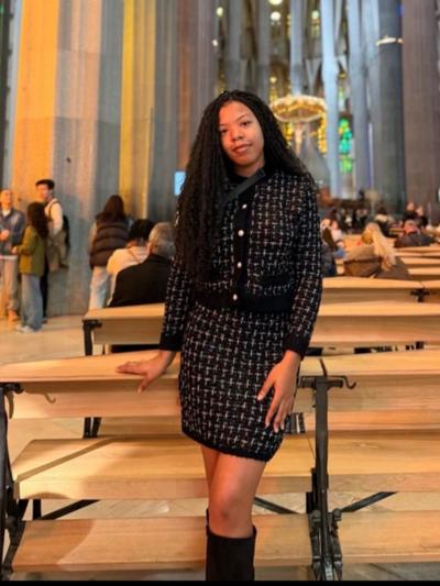 Jayla standing in an old building posing.