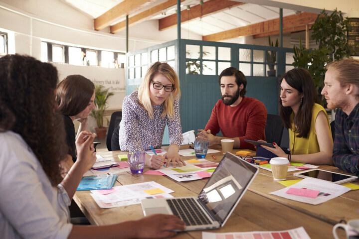 Meeting Woman taking lead in a meeting