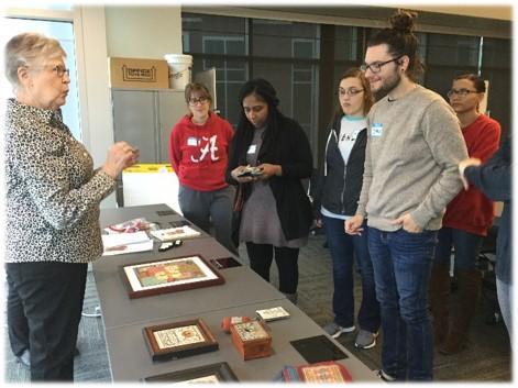 Students looking at table