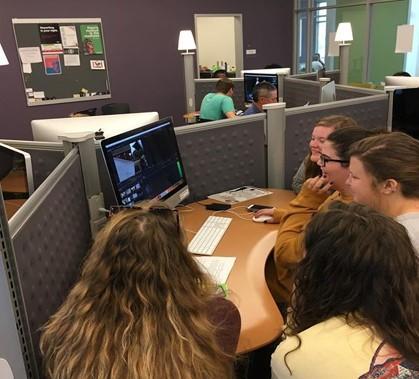 Students around computer