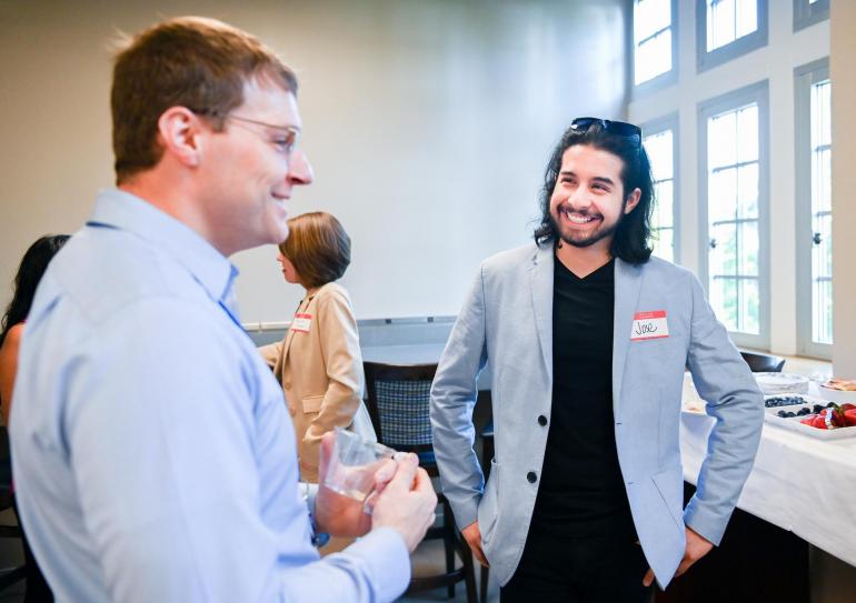 Mentor Mixer Student and mentor engage in conversation