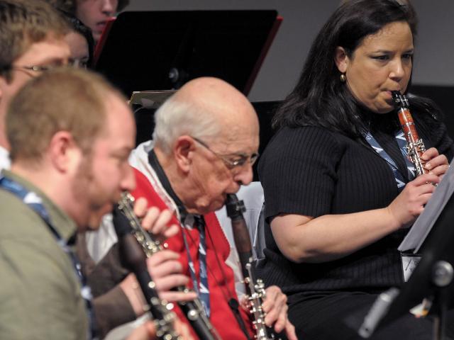 Community members play clarinets