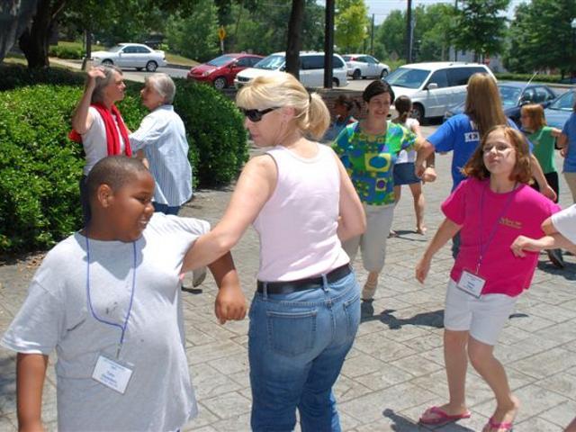 Teachers and students dance outside